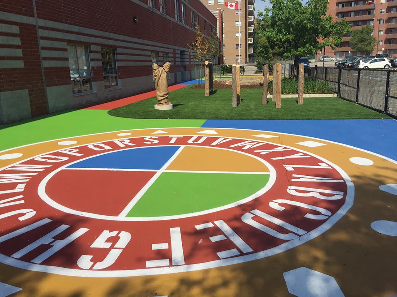 Public art pavement installation — DecoMark and StreetBond custom civic mural and cultural identity street surface at Joyce-Collingwood Skytrain Station