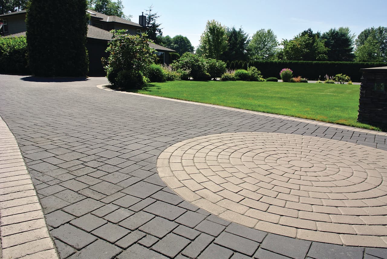 Residential StreetPrint driveway — aerial view, circular stamp pattern, home with double garage