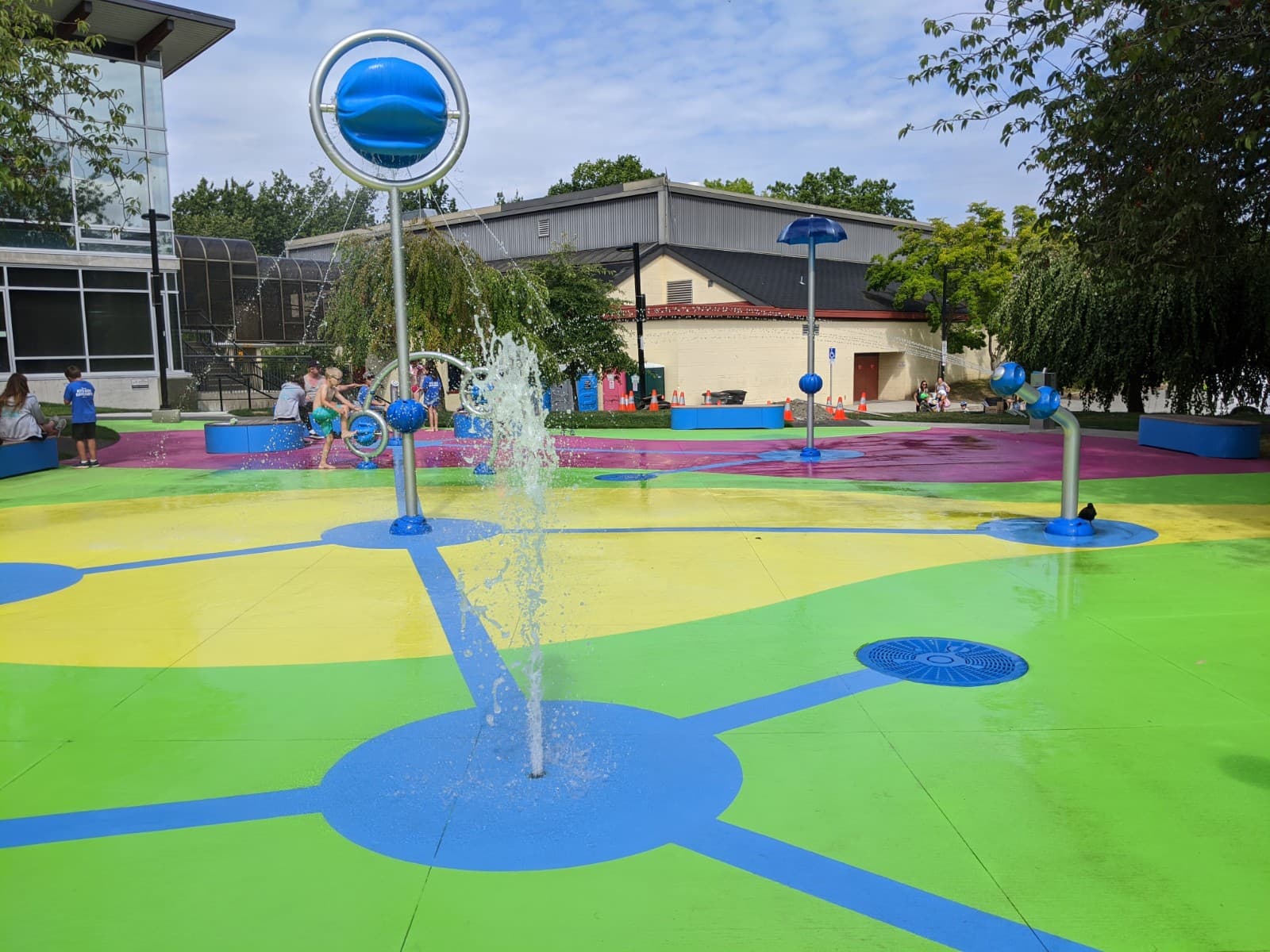 Splash pad surfacing at a community water play area in Canada — installed by HUB Surface Systems