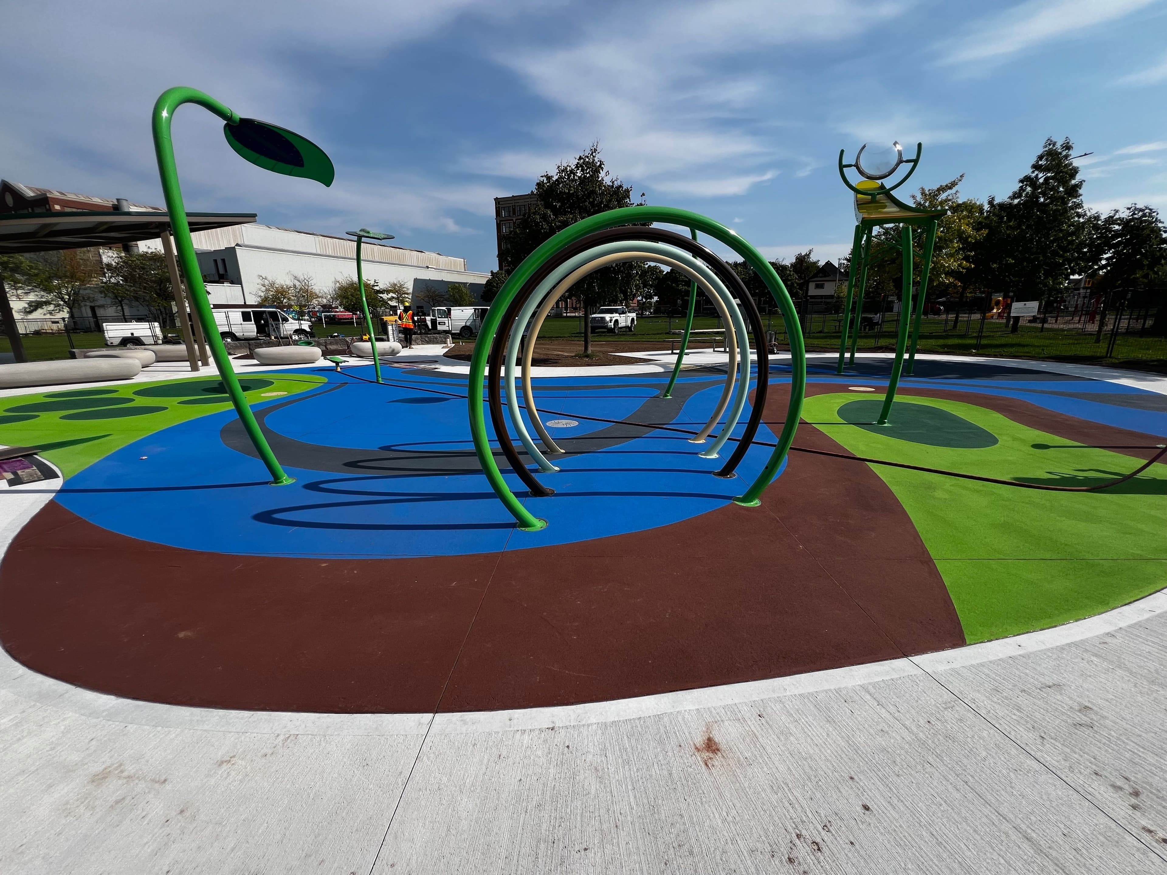 Splash pad surfacing in slip-resistant coloured surface coating — a municipal splash pad, Canada