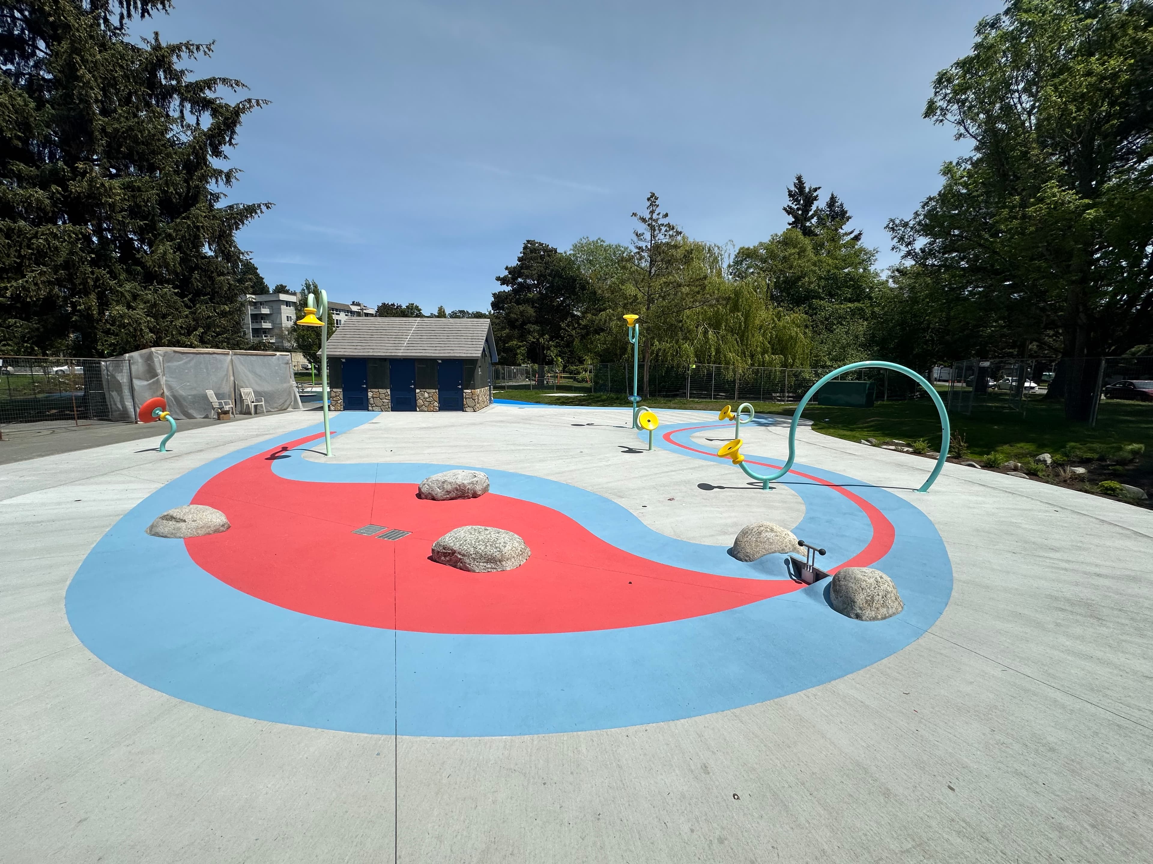 Splash pad surfacing in slip-resistant coloured surface coating — a community water play area, Canada