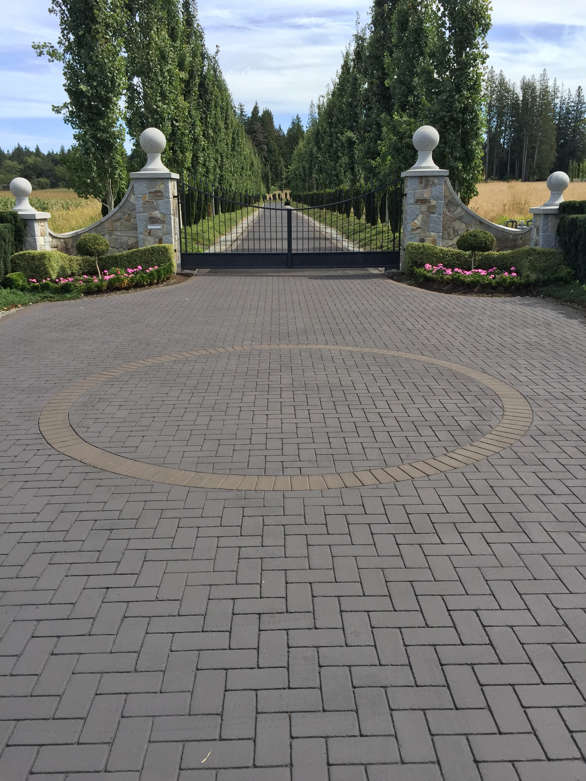 StreetPrint stamped asphalt decorative driveway — estate herringbone pattern with circular medallion, installed by HUB Surface Systems